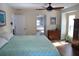 Comfortable bedroom with hardwood floors and a view of the outdoors at 2810 Norwood Ln, Venice, FL 34292