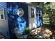 Charming Shed with white trim, steps, chair, and ' Shed' sign at 2810 Norwood Ln, Venice, FL 34292