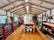 Spacious workshop features exposed beams, storage cabinets, and various tools and equipment at 2810 Norwood Ln, Venice, FL 34292