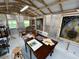 Craft Shed interior featuring windows, tables, stained glass, and exposed beams at 2810 Norwood Ln, Venice, FL 34292