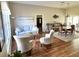 Bright living room with hardwood floors, neutral walls, comfortable seating, and an open floor plan at 2810 Norwood Ln, Venice, FL 34292
