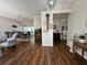 Spacious living room featuring hardwood floors, neutral walls, stylish decor, and an open layout at 2810 Norwood Ln, Venice, FL 34292