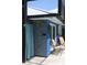 Unique outdoor shower featuring colorful tile, a privacy curtain, and convenient access to the pool area at 2810 Norwood Ln, Venice, FL 34292