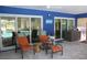 Relaxing covered patio with comfortable seating and an outdoor ceiling fan with a view of the pool at 2810 Norwood Ln, Venice, FL 34292