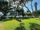 Expansive backyard featuring a well-manicured lawn and mature trees, offering a serene outdoor space at 2860 58Th S Cir, St Petersburg, FL 33712