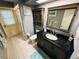 Bathroom featuring a vanity with a large black countertop and a shower at 2860 58Th S Cir, St Petersburg, FL 33712