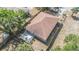 Aerial view of home with new roof and a fenced-in backyard with concrete patio at 3208 E 8Th Ave, Tampa, FL 33605