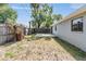 Good sized, grassy backyard with a concrete patio and privacy fence at 3208 E 8Th Ave, Tampa, FL 33605
