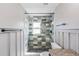 Bathroom with mosaic tiled shower stall, granite countertop, and modern fixtures at 3208 E 8Th Ave, Tampa, FL 33605