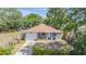 Charming single-story home with a well-manicured front yard and attached one-car garage at 3208 E 8Th Ave, Tampa, FL 33605