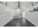Spacious garage includes laundry area with washer and dryer, and features epoxy flooring at 3208 E 8Th Ave, Tampa, FL 33605