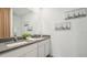 Bathroom featuring double vanity and wall decor at 33088 Osprey Peak Way, San Antonio, FL 33576