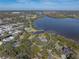 Expansive aerial shot of waterfront home, highlighting its serene setting and convenient access to bay at 3484 Shore Dr, Safety Harbor, FL 34695