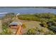 Scenic backyard with a gazebo, walkway, and waterfront view at 3484 Shore Dr, Safety Harbor, FL 34695