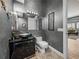 Stylish bathroom featuring a unique glass bowl sink, dark vanity, and modern finishes at 3484 Shore Dr, Safety Harbor, FL 34695