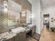 Modern bathroom with double vanity, granite countertops, and decorative tile backsplash at 3484 Shore Dr, Safety Harbor, FL 34695