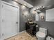 Contemporary bathroom with wood-look tile, sleek vanity with vessel sink, and decorative starfish accents at 3484 Shore Dr, Safety Harbor, FL 34695