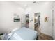 Bright bedroom with ensuite bathroom, light walls, and natural light at 3484 Shore Dr, Safety Harbor, FL 34695