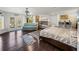 Inviting bedroom with hardwood floors, bunk beds, a sitting area, and outdoor access at 3484 Shore Dr, Safety Harbor, FL 34695