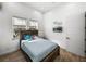 Inviting bedroom featuring wood-look floors, light walls, and windows that let in plenty of natural light at 3484 Shore Dr, Safety Harbor, FL 34695