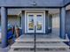 Front entrance showcasing double doors, columns, and a stone walkway at 3484 Shore Dr, Safety Harbor, FL 34695