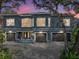 Magnificent two-story home boasts large windows, a three-car garage, and stunning architecture at 3484 Shore Dr, Safety Harbor, FL 34695