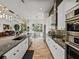 Bright open kitchen features a large island, stainless appliances, and access to dining area at 3484 Shore Dr, Safety Harbor, FL 34695
