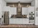 Bright kitchen with stainless steel appliances, granite countertops, and sleek cabinetry at 3484 Shore Dr, Safety Harbor, FL 34695