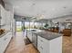 Modern kitchen with granite countertops, stainless appliances, and an open design at 3484 Shore Dr, Safety Harbor, FL 34695