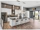 Modern kitchen features a large island with seating, stainless steel appliances, and stylish backsplash at 3484 Shore Dr, Safety Harbor, FL 34695