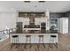 Modern kitchen features a large island with seating, stainless steel appliances, and stylish backsplash at 3484 Shore Dr, Safety Harbor, FL 34695