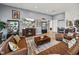 Open living area with leather seating, display cases and large screen TV at 3484 Shore Dr, Safety Harbor, FL 34695