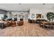 Spacious living room with wood-look tile flooring, neutral color scheme, and ample seating at 3484 Shore Dr, Safety Harbor, FL 34695