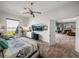 Bright bedroom with waterfront view, comfortable chair and decorative bed at 3484 Shore Dr, Safety Harbor, FL 34695