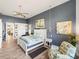 Spacious main bedroom with seating area, walk-in closet, and serene decor at 3484 Shore Dr, Safety Harbor, FL 34695