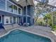 The screened pool area offers an inground pool, seating area, and plenty of outdoor space at 3484 Shore Dr, Safety Harbor, FL 34695