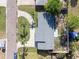 Aerial view of a well-maintained home with manicured lawn and a spacious driveway in a residential neighborhood at 352 79Th Ne Ave, St Petersburg, FL 33702