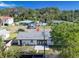 Residential home featuring a new roof in a quiet neighborhood with mature trees and a well-maintained yard at 352 79Th Ne Ave, St Petersburg, FL 33702