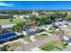 An aerial view of a charming single-story home with a well-manicured front yard, complemented by mature palm trees at 352 79Th Ne Ave, St Petersburg, FL 33702