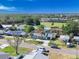 Aerial view of a charming suburban home surrounded by mature trees and a well-maintained landscape at 352 79Th Ne Ave, St Petersburg, FL 33702