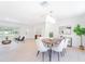Bright and airy dining room with modern decor, contemporary light fixture, and an open floor plan at 352 79Th Ne Ave, St Petersburg, FL 33702