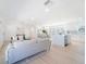 Open-concept living area flows to the kitchen, perfect for entertaining, with modern decor and hardwood floors at 352 79Th Ne Ave, St Petersburg, FL 33702