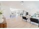 Bright, open-concept living room with a dining area, modern kitchen, and stylish contemporary decor at 352 79Th Ne Ave, St Petersburg, FL 33702