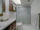 Bathroom featuring a vanity with dark cabinets, a toilet, and a glass-enclosed shower stall at 39650 Us Highway 19 N # 743, Tarpon Springs, FL 34689