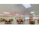 Spacious clubhouse with tables and chairs, perfect for community events and gatherings at 39650 Us Highway 19 N # 743, Tarpon Springs, FL 34689