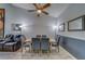 Well-lit dining room featuring a modern table with seating and stylish decor at 39650 Us Highway 19 N # 743, Tarpon Springs, FL 34689