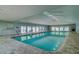 Bright indoor pool with clear blue water, providing a relaxing swimming option for residents at 39650 Us Highway 19 N # 743, Tarpon Springs, FL 34689