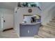 Open-concept kitchen with granite counters, stainless steel appliances, and a view of the staircase at 39650 Us Highway 19 N # 743, Tarpon Springs, FL 34689