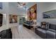 Cozy living room with high ceilings, art, and a balcony, creating a relaxing space at 39650 Us Highway 19 N # 743, Tarpon Springs, FL 34689