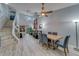 Open-concept living area featuring a dining area and a two story ceiling at 39650 Us Highway 19 N # 743, Tarpon Springs, FL 34689